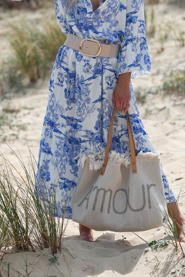 Model wearing Tiered maxi dress with toile de jouy royal blue print