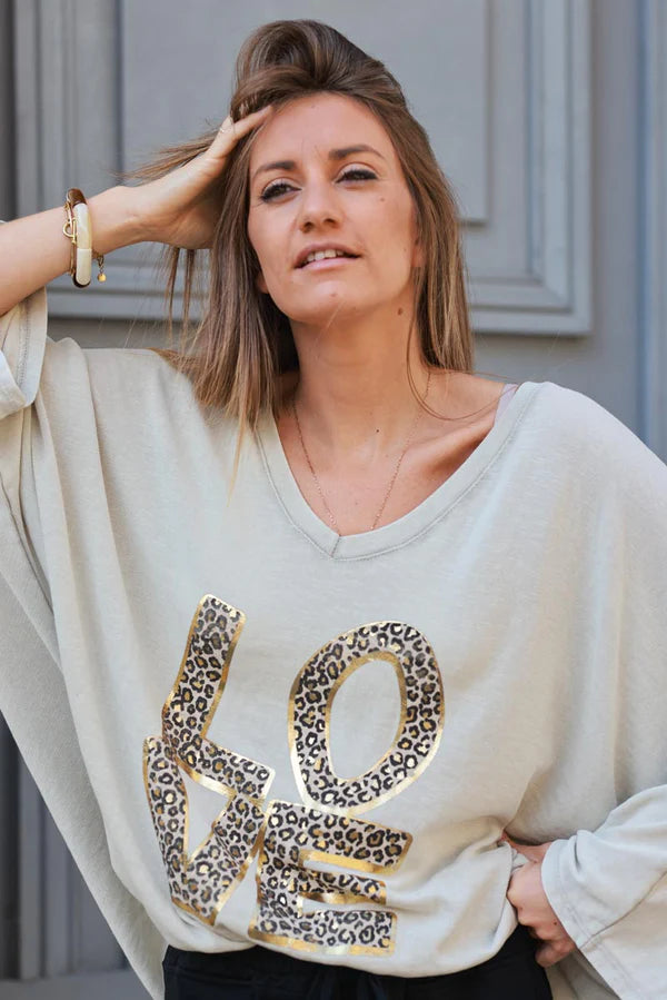 Beige stretch fine knit batwing top with Love print