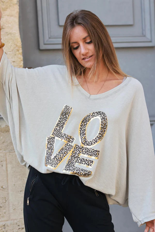 Beige stretch fine knit batwing top with Love print