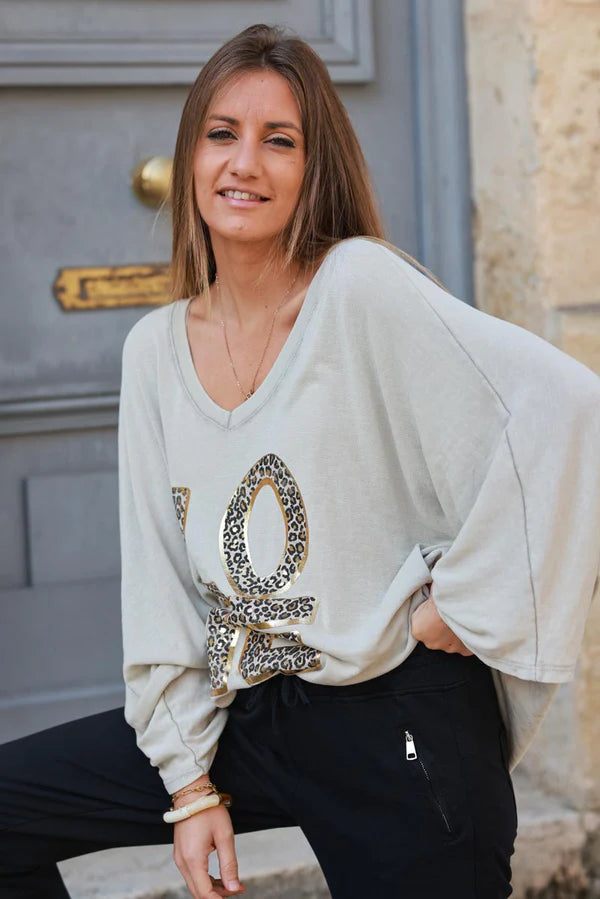 Beige stretch fine knit batwing top with Love print