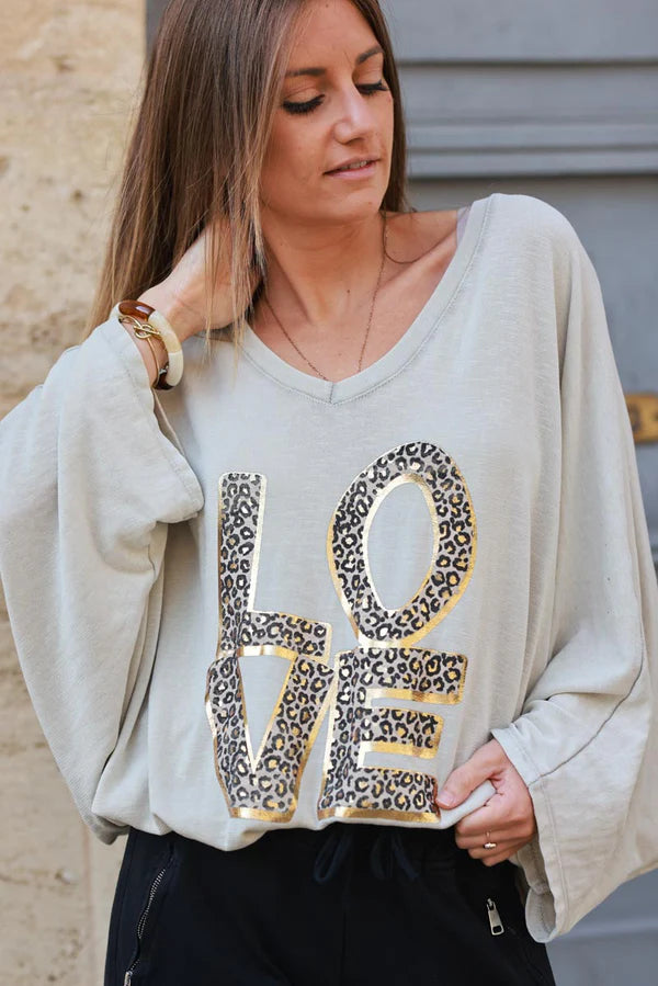 Beige stretch fine knit batwing top with Love print