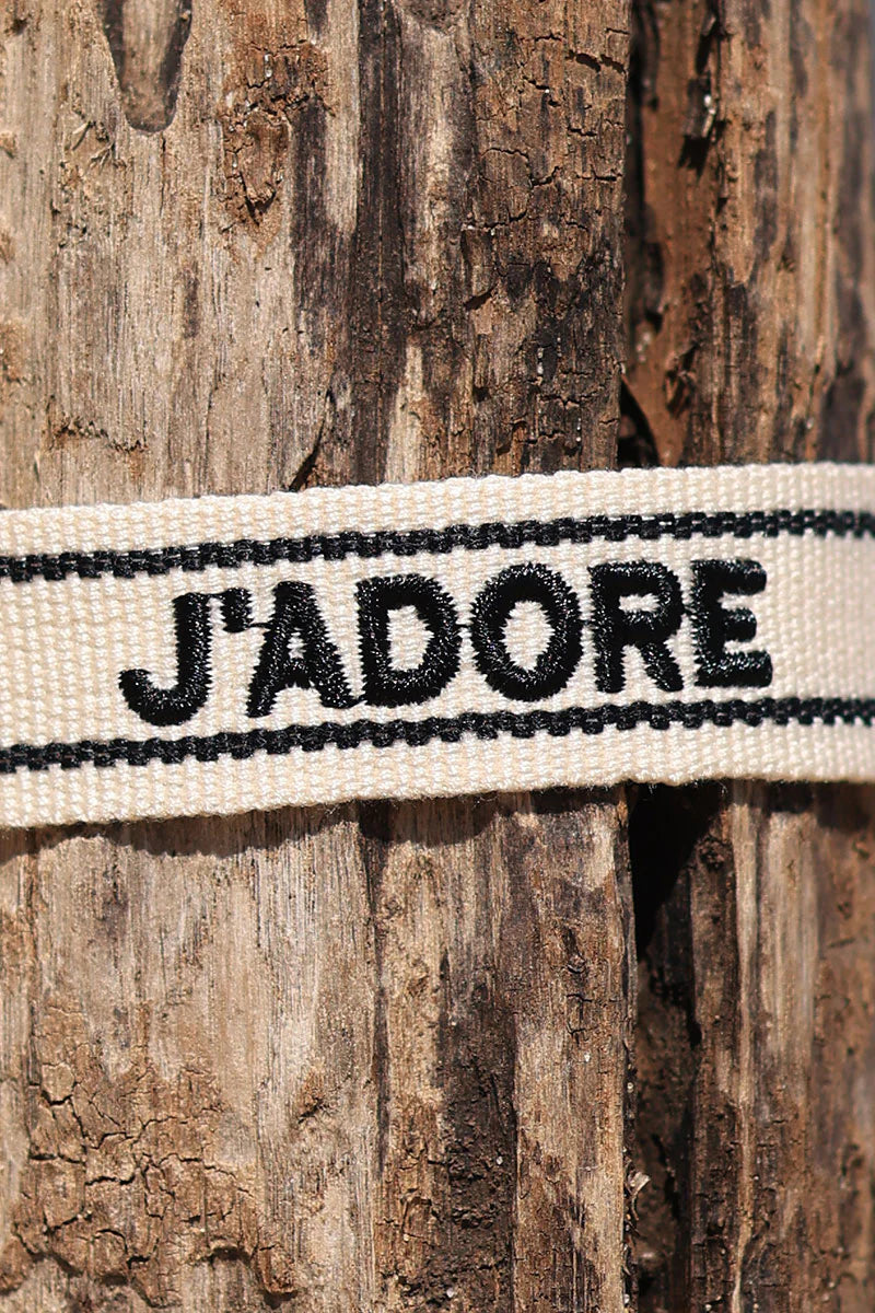 Ecru fabric bracelet with black 'J'adore' embroidery