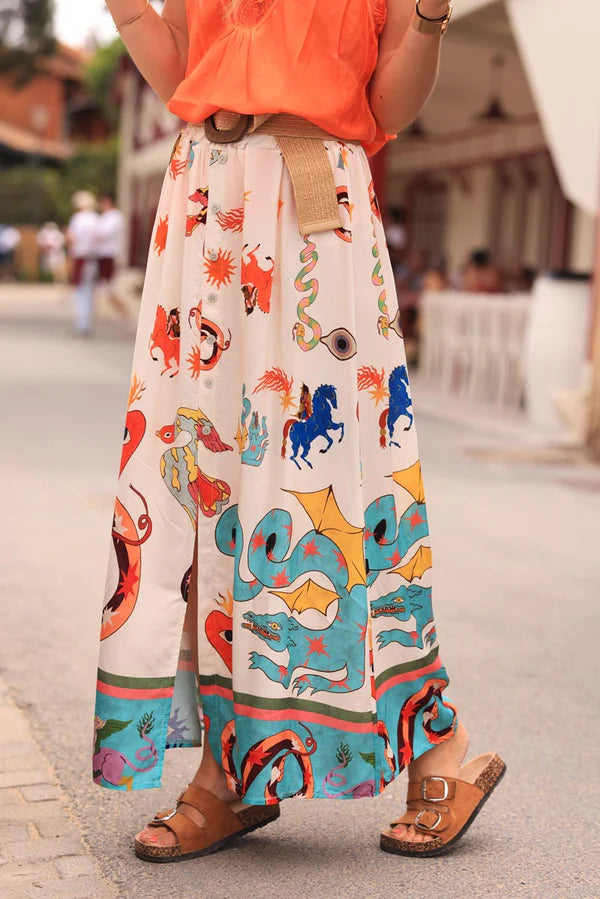 Off white floaty skirt with slit and colorful symbols zodiac signs print