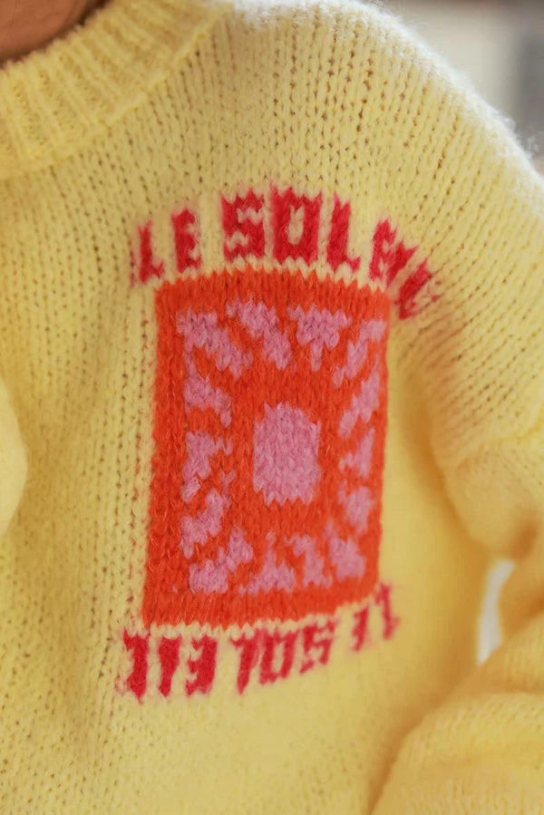 Pastel Yellow Chunky Knit Sweater with Vibrant Sun Embroidery