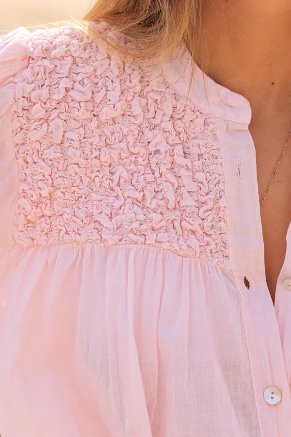 Smocked soft pink floaty blouse with mother of pearl buttons