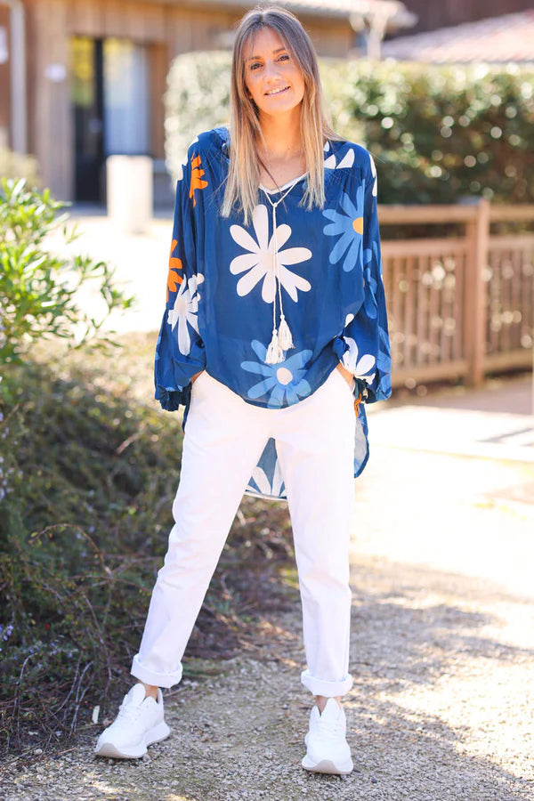 White stretch chino pants with tortoise shell buttons