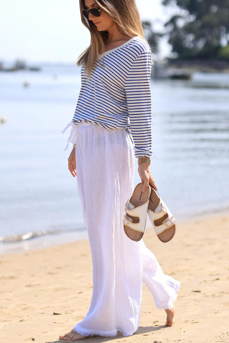 White faux leather sandals with double straps and gold embroidery